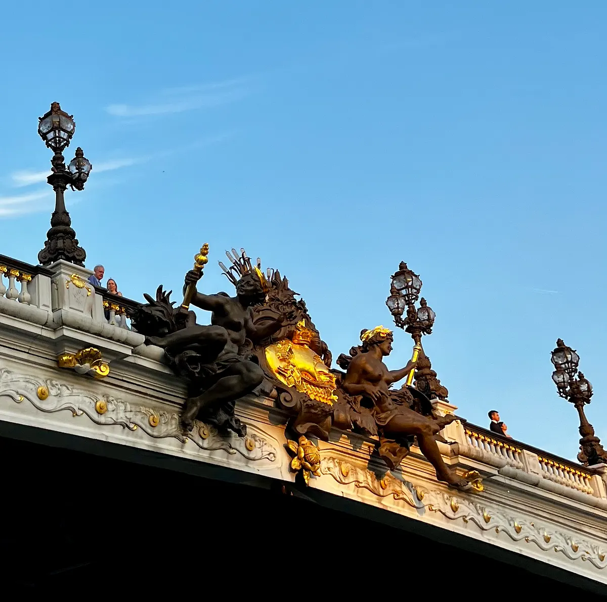 Statues of the Seine river nymphs with the arms of Paris, on the Pont Alexandre III